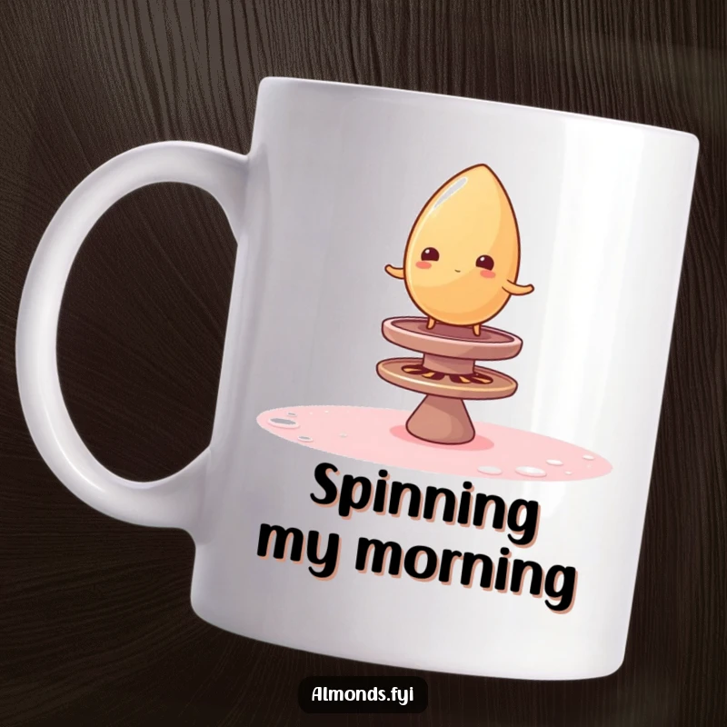 Funny mug showing a wobbly almond precariously balancing on a spinning sugar top, a comical and sweet design.