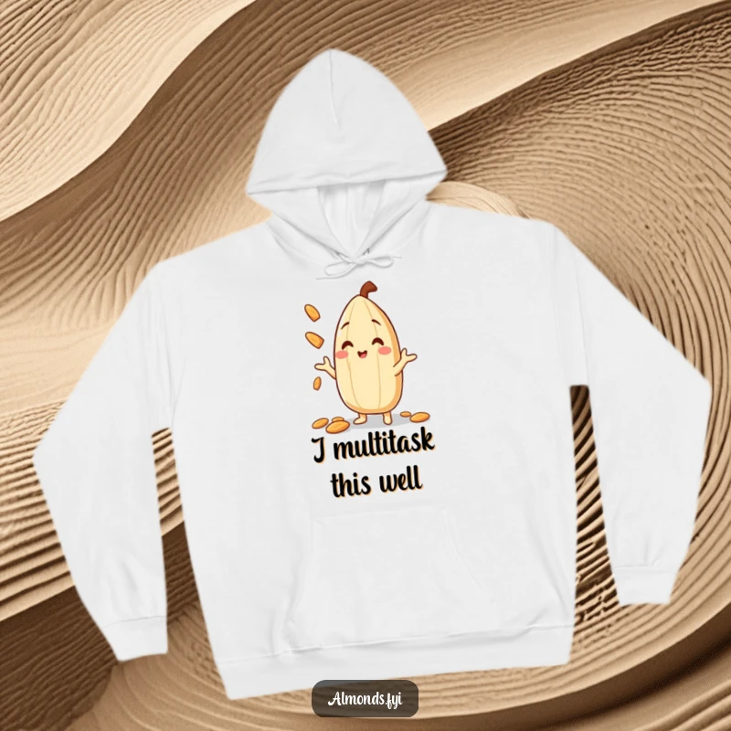 Funny Hoodie showcasing a smiling almond character masterfully juggling small almond slivers, promising warmth and nutty entertainment.
