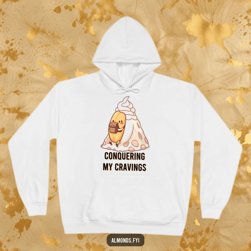Funny determined almond with a backpack hiking a whipped cream mountain, on a cozy hoodie.