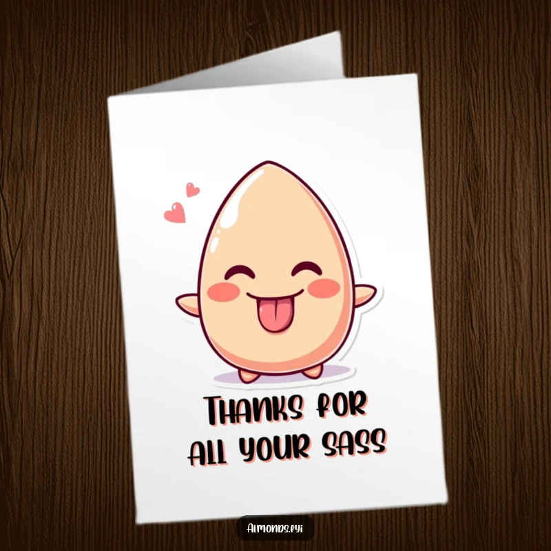 Funny free printable thank you card featuring a cute almond sticking its tongue out playfully with a wide, cheeky grin.