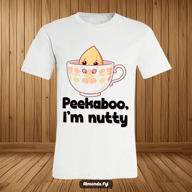 Funny t-shirt featuring a curious almond character peering over the edge of a giant teacup, showcasing its adventurous spirit.
